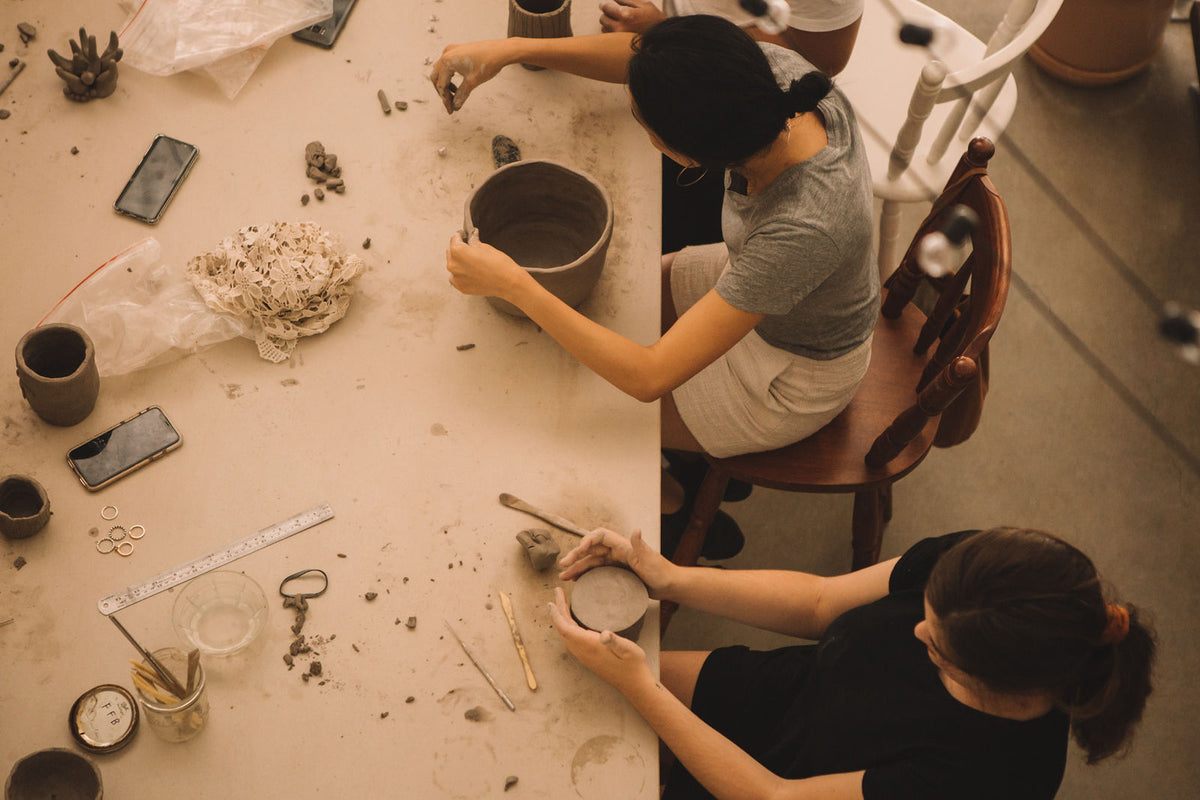 Two students making pottery together, Clay & Wine class, Nambour