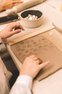 Imprinting clay slabs with shells, hand building technique, Nambour