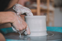 Woman makes pottery on the wheel, sunshine coast, nambour, queensland, pottery studio, intermediate level, clay 
