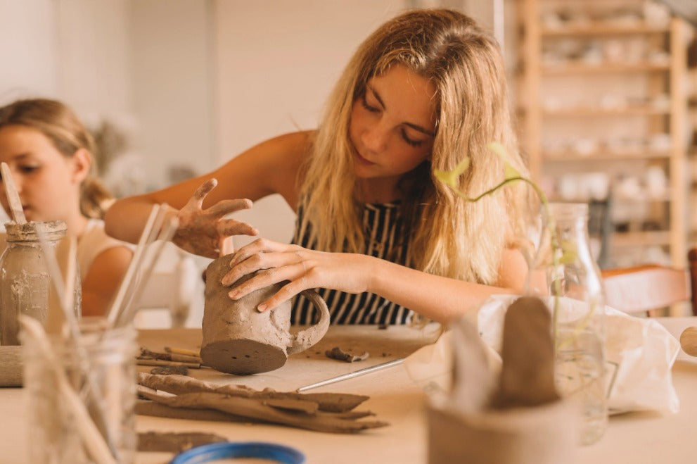 Teenager making pottery in kids pottery class, Nambour
